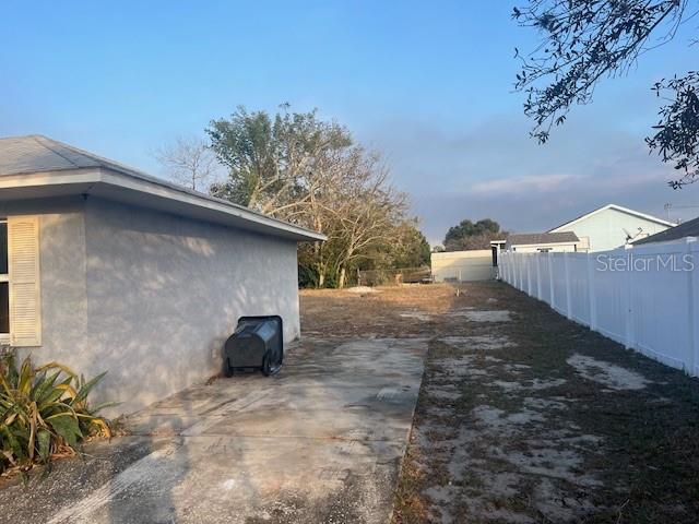 6702 Rocky Point Road Lake Wales, FL 33898 - Photo 2 of 10 a backyard of a house