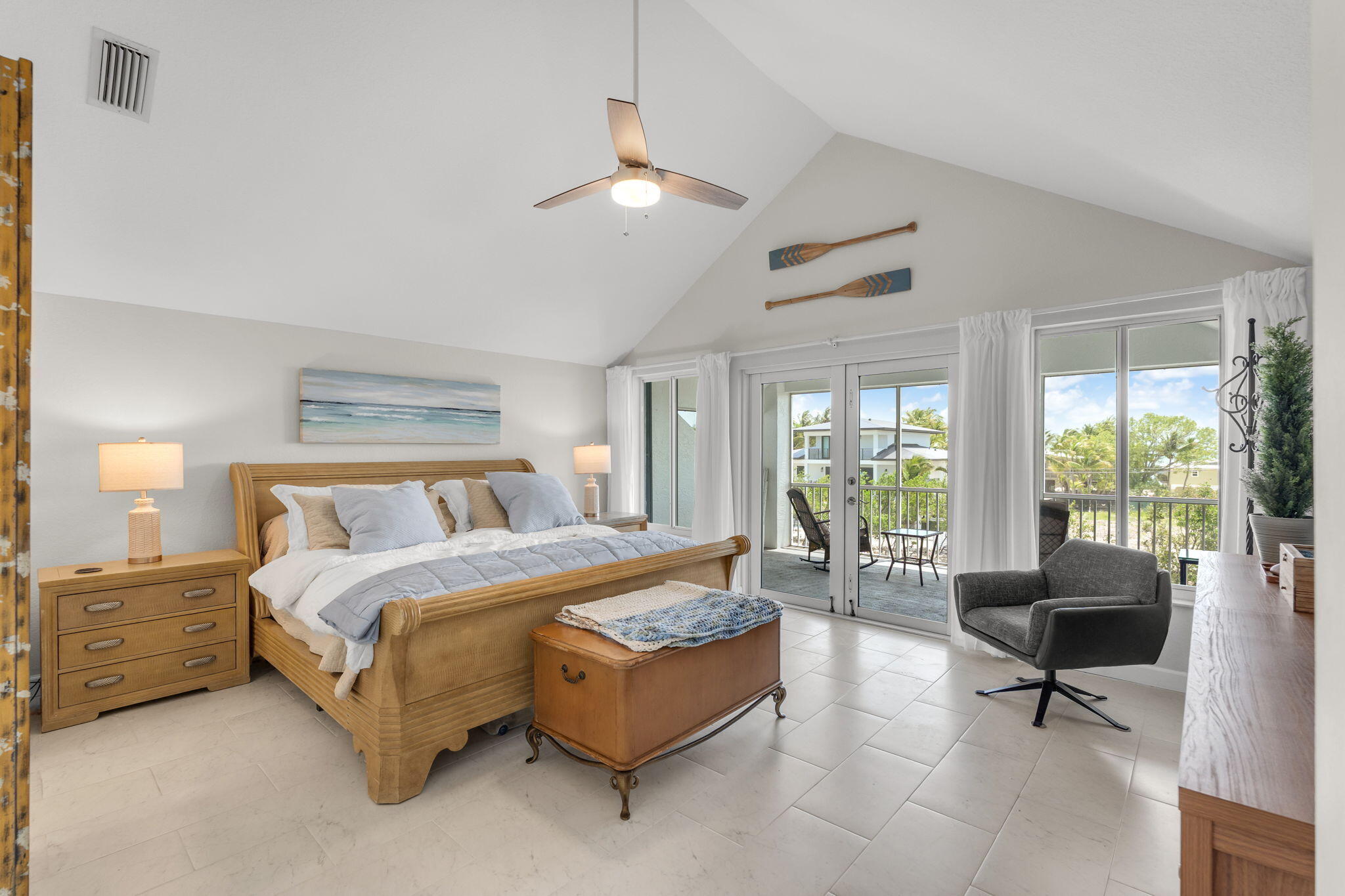24 Mutiny Place Key Largo, FL 33037 - Photo 24 of 69 a spacious bedroom with a bed a table and a couch