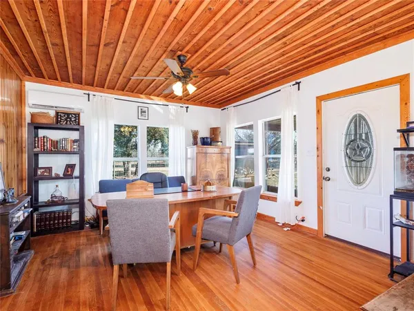 a dining room with furniture window wooden floor