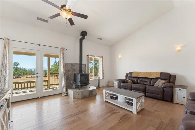 a kitchen with granite countertop cabinets and dining table in it