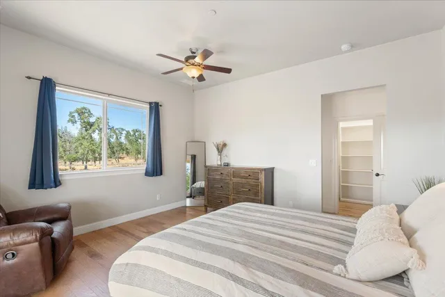 a view of room with furniture and wooden floor