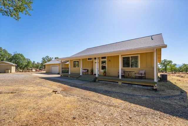a view of a town with trees in the background
