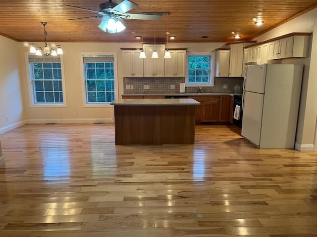 204 Stover Shop Road Churchville, VA 24421 - Photo 10 of 52 a kitchen with stainless steel appliances granite countertop a refrigerator a sink dishwasher a stove and a dining table with wooden floor