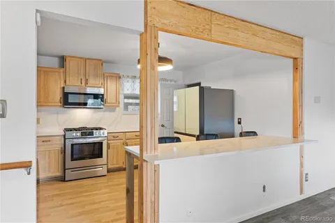 a kitchen with stainless steel appliances granite countertop a stove and a sink