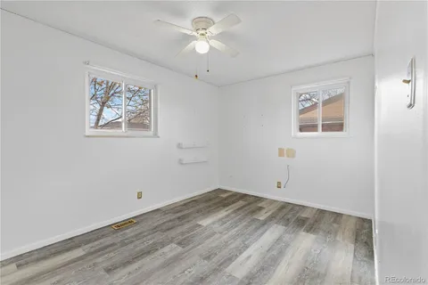 a view of room with window and ceiling fan