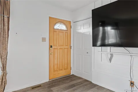 a view of entryway with wooden floor