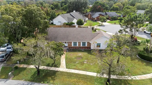 an aerial view of house with yard swimming pool and outdoor seating