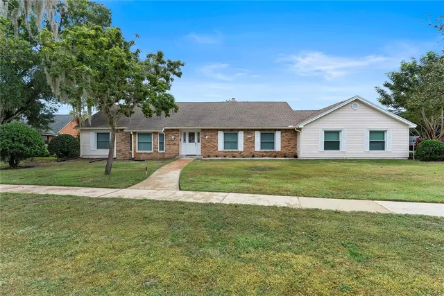 a view of house with a garden