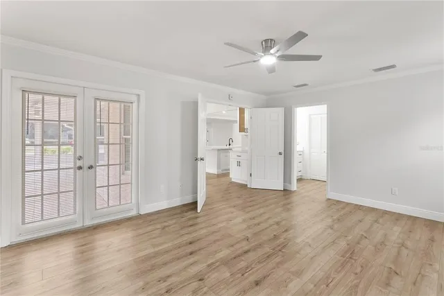 a view of an empty room with a window