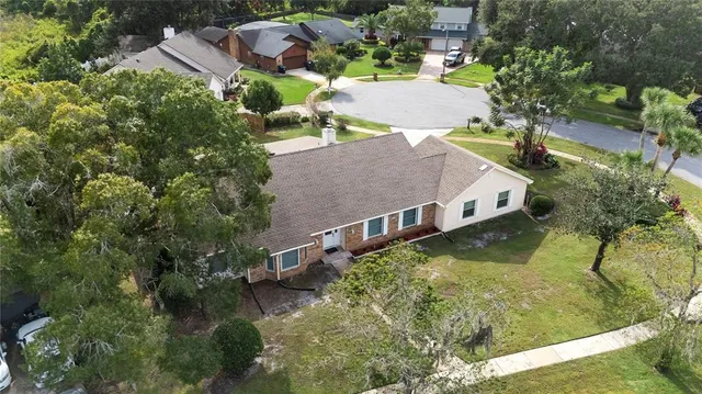 an aerial view of houses with yard