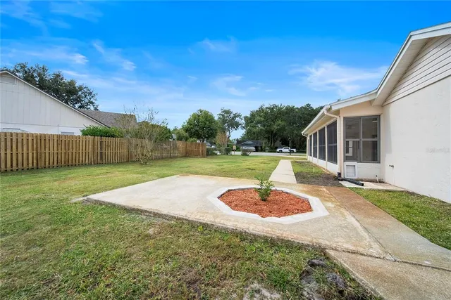 a swimming pool with wooden fence