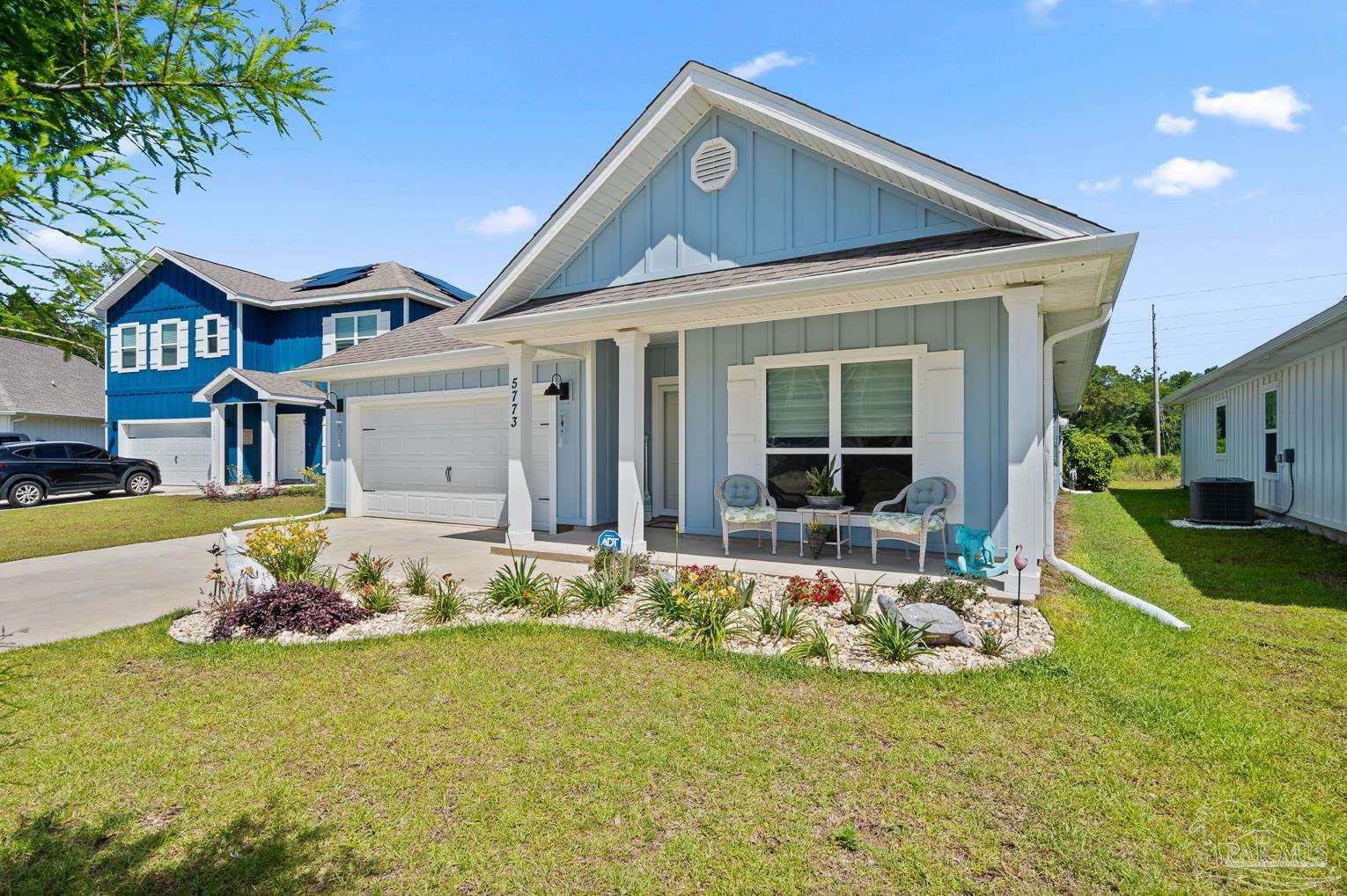 5773 Danbury Boulevard Pace, FL 32571 - Photo 1 of 34 a front view of a house with a yard