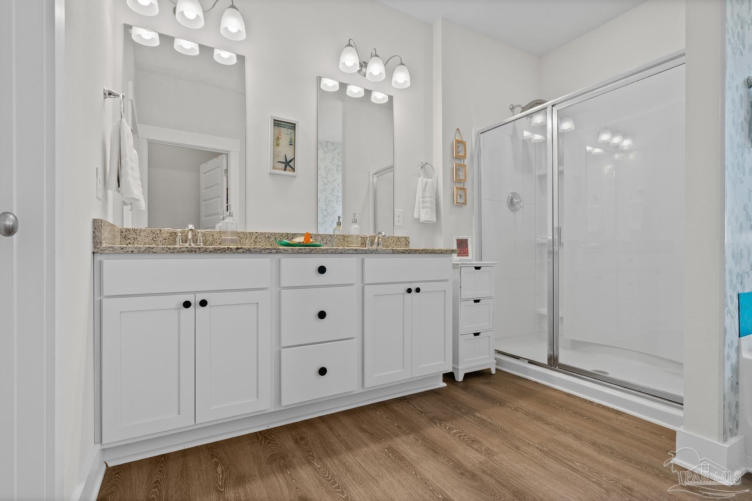 5773 Danbury Boulevard Pace, FL 32571 - Photo 18 of 34 a bathroom with a granite countertop sink mirror and a