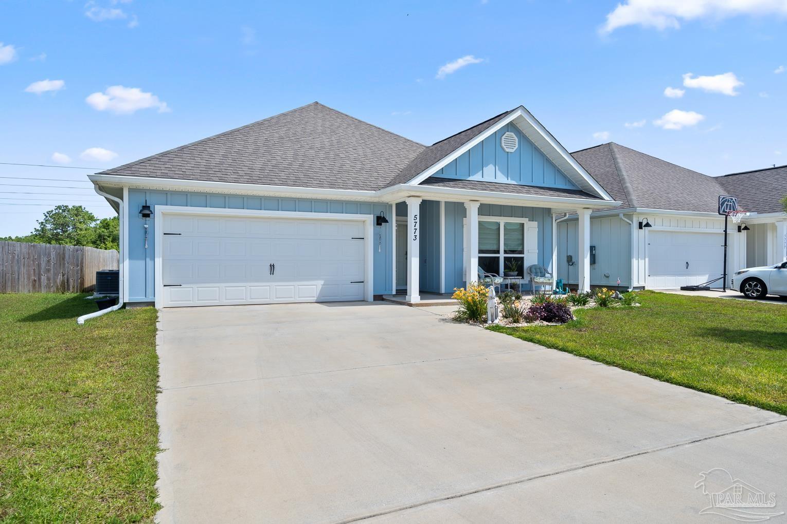 5773 Danbury Boulevard Pace, FL 32571 - Photo 2 of 34 a view of a house with backyard and porch