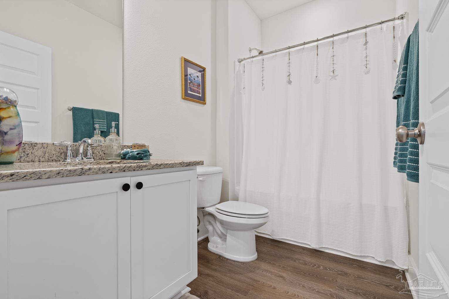 5773 Danbury Boulevard Pace, FL 32571 - Photo 24 of 34 a bathroom with a granite countertop sink toilet and shower