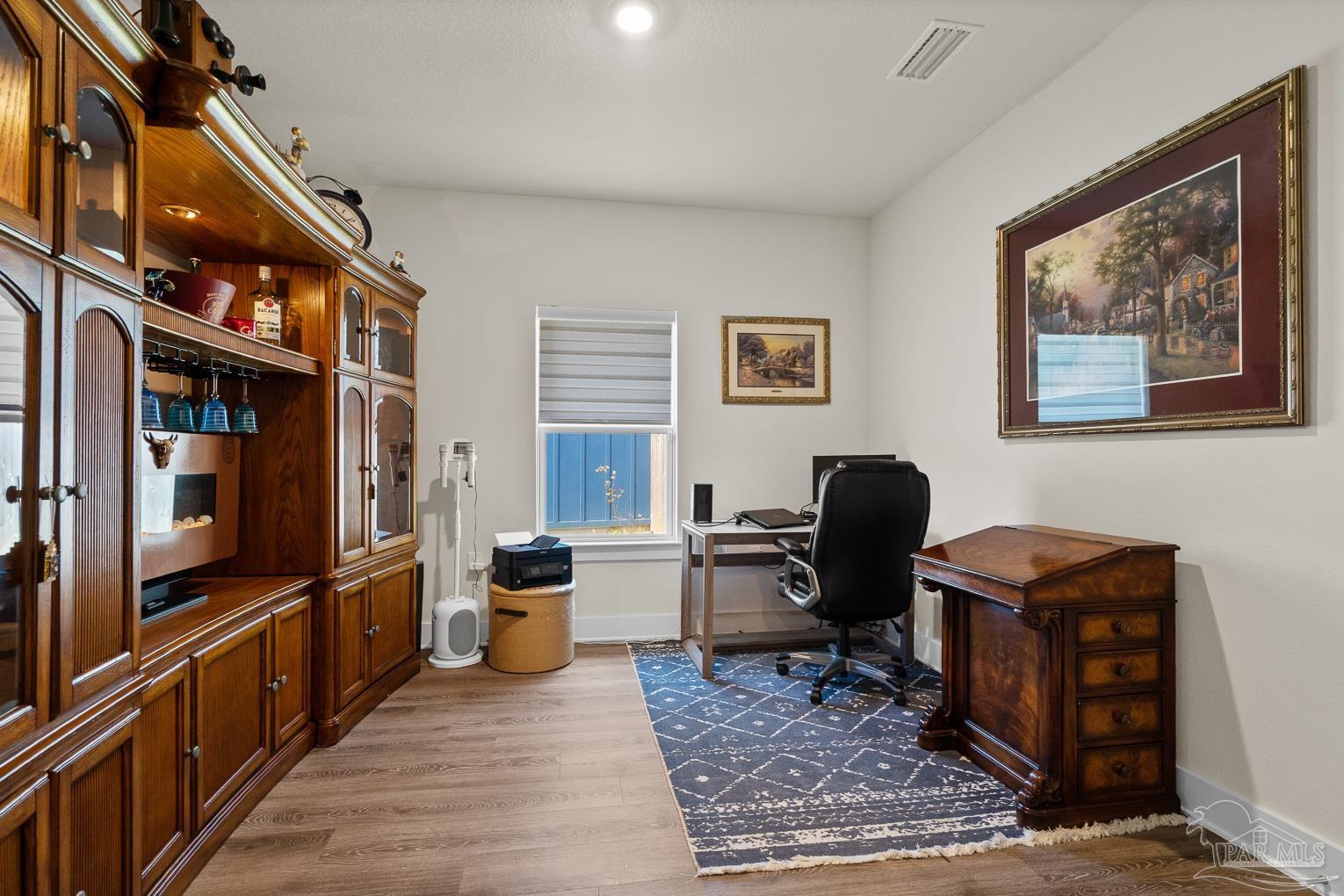 5773 Danbury Boulevard Pace, FL 32571 - Photo 25 of 34 a view of a workspace with furniture