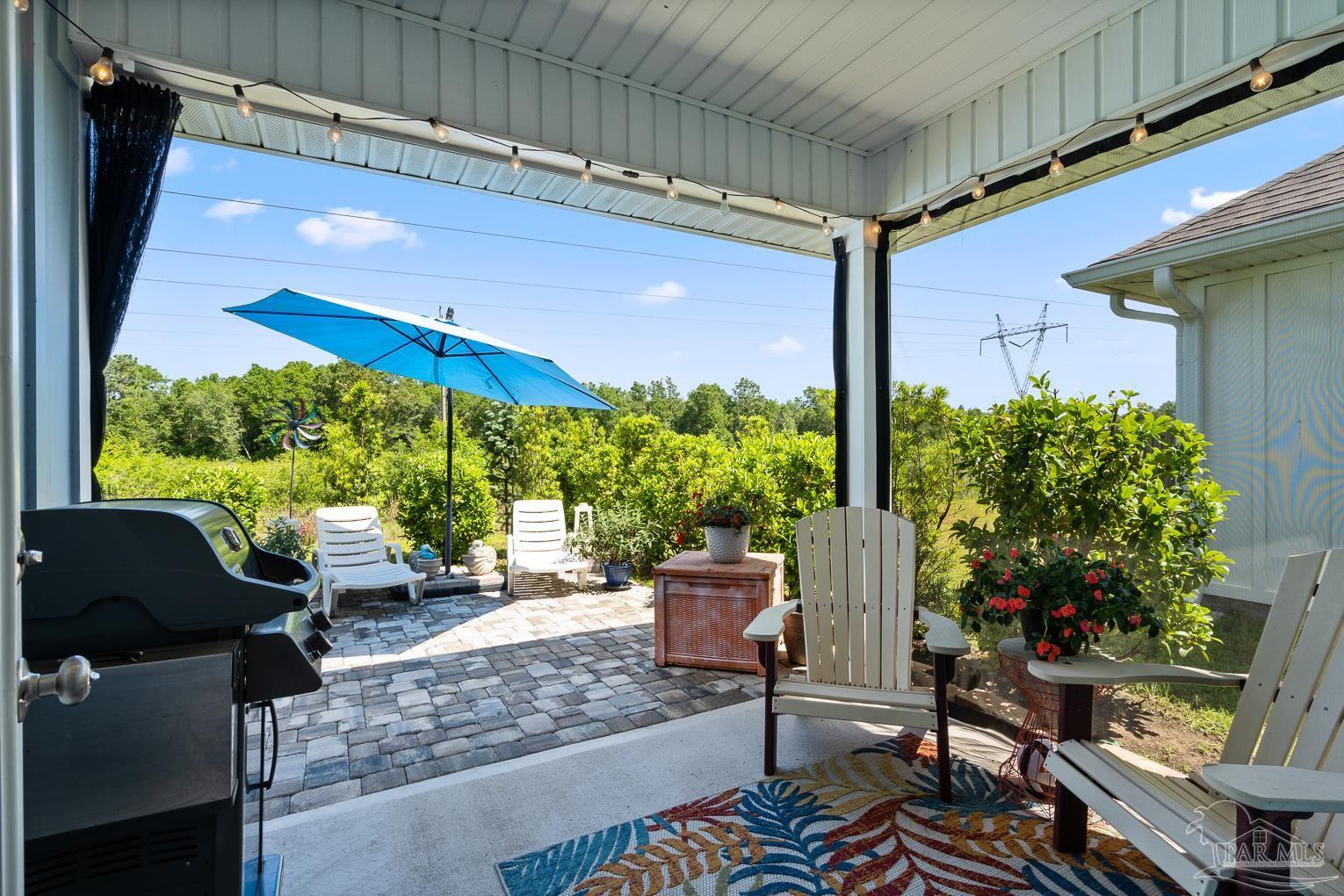 5773 Danbury Boulevard Pace, FL 32571 - Photo 27 of 34 a building outdoor space with patio furniture