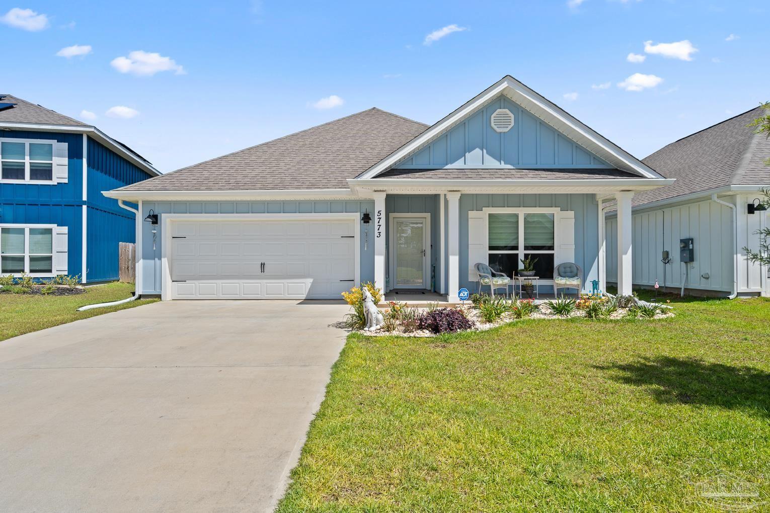 5773 Danbury Boulevard Pace, FL 32571 - Photo 3 of 34 a view of a house with swimming pool and porch with furniture