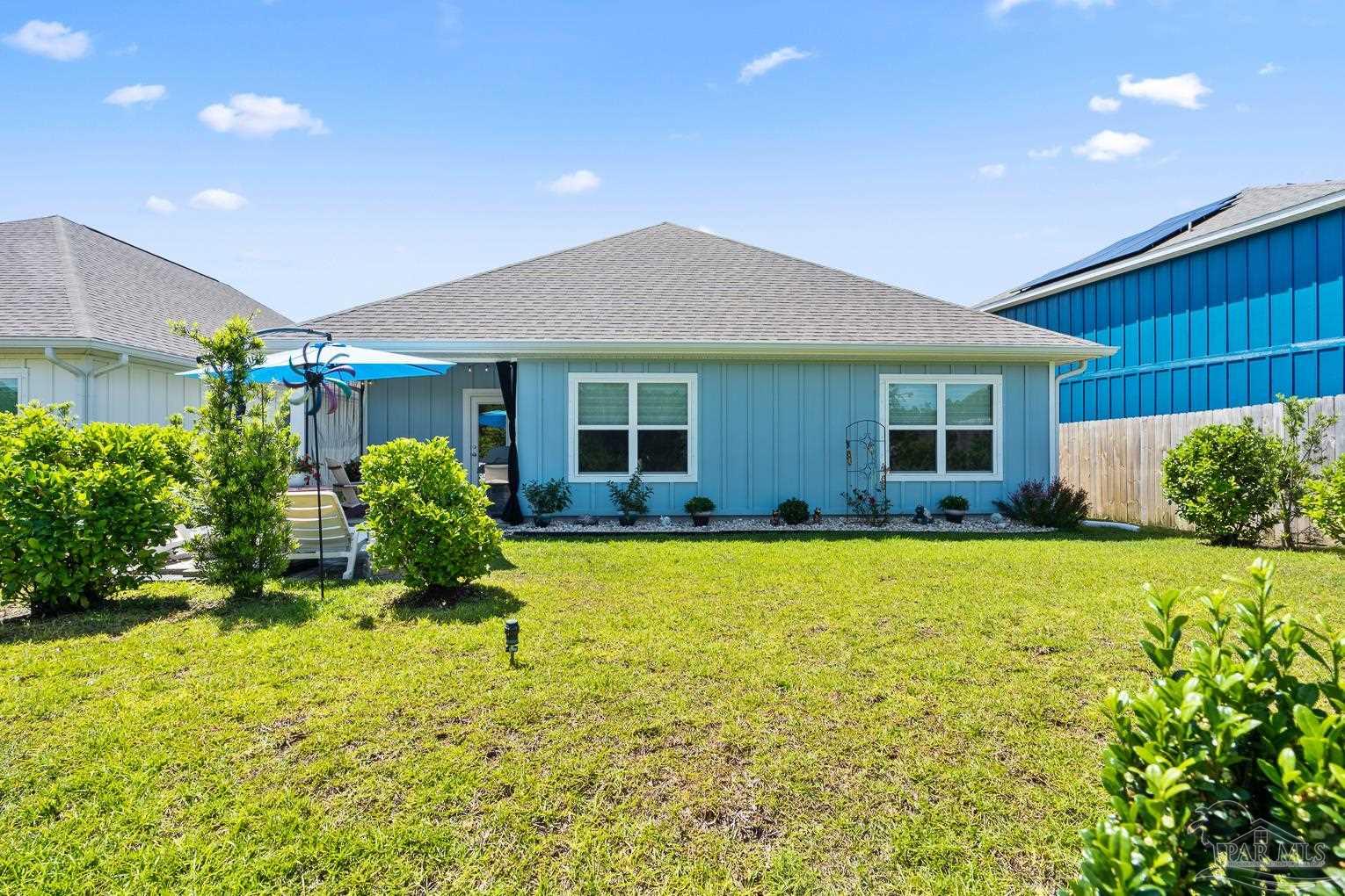 5773 Danbury Boulevard Pace, FL 32571 - Photo 31 of 34 a house view with a garden space