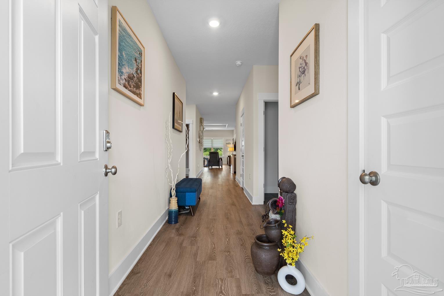 5773 Danbury Boulevard Pace, FL 32571 - Photo 4 of 34 a view of a hallway with wooden floor and entryway