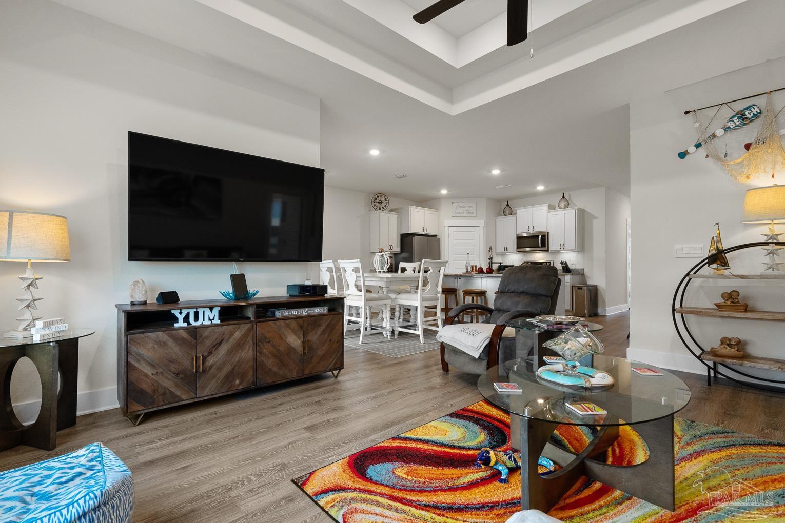 5773 Danbury Boulevard Pace, FL 32571 - Photo 5 of 34 a living room with furniture and a flat screen tv