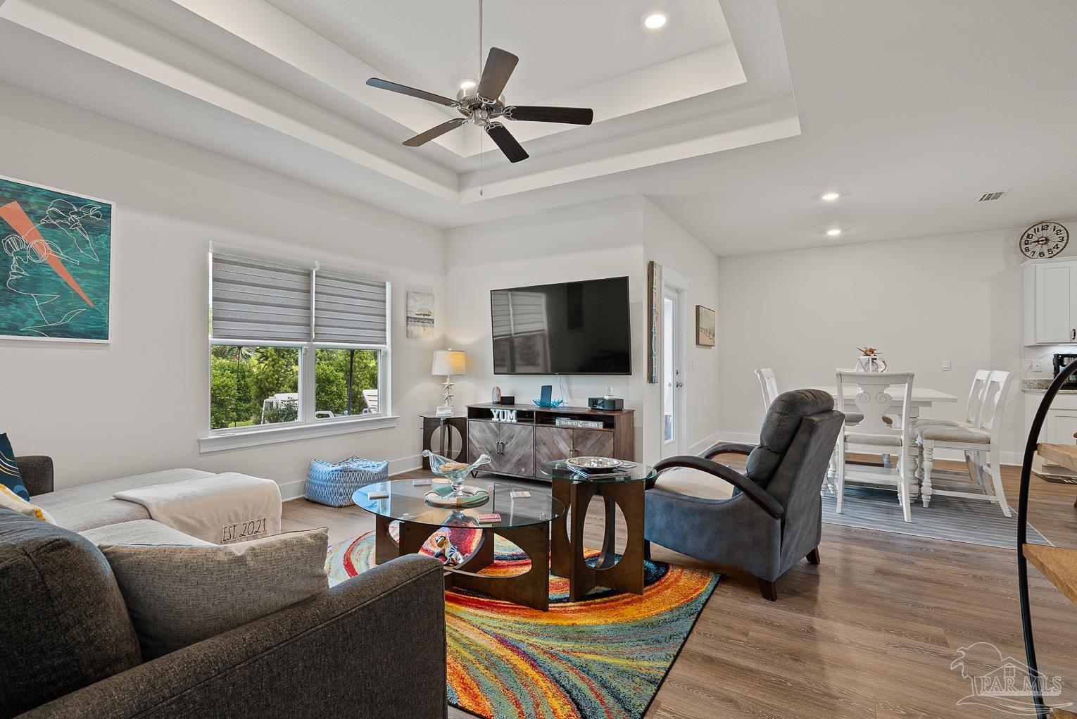 5773 Danbury Boulevard Pace, FL 32571 - Photo 6 of 34 a living room with furniture and a flat screen tv