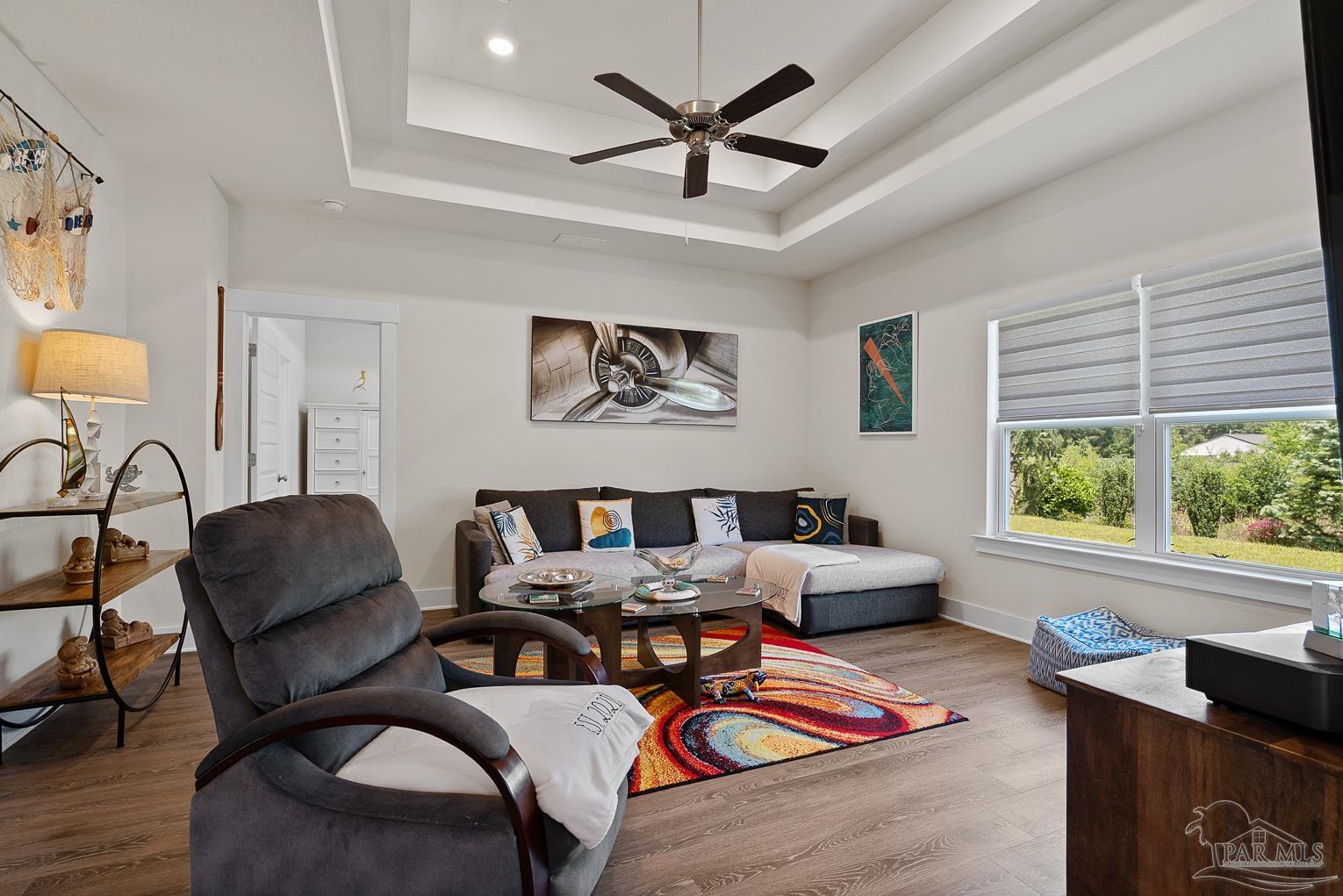 5773 Danbury Boulevard Pace, FL 32571 - Photo 7 of 34 a living room with furniture and a large window