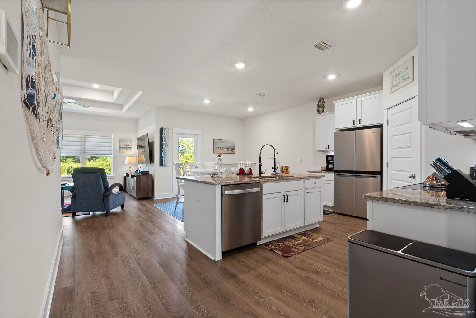 5773 Danbury Boulevard Pace, FL 32571 - Photo 10 of 34 a kitchen with sink cabinets and wooden floor