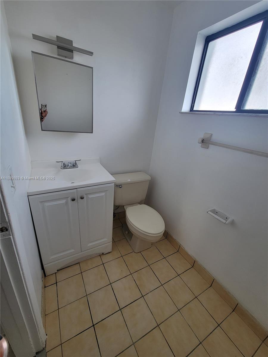 355 East 33rd Street, Unit 203 Hialeah, FL 33013 - Photo 6 of 13 Half bath downstairs