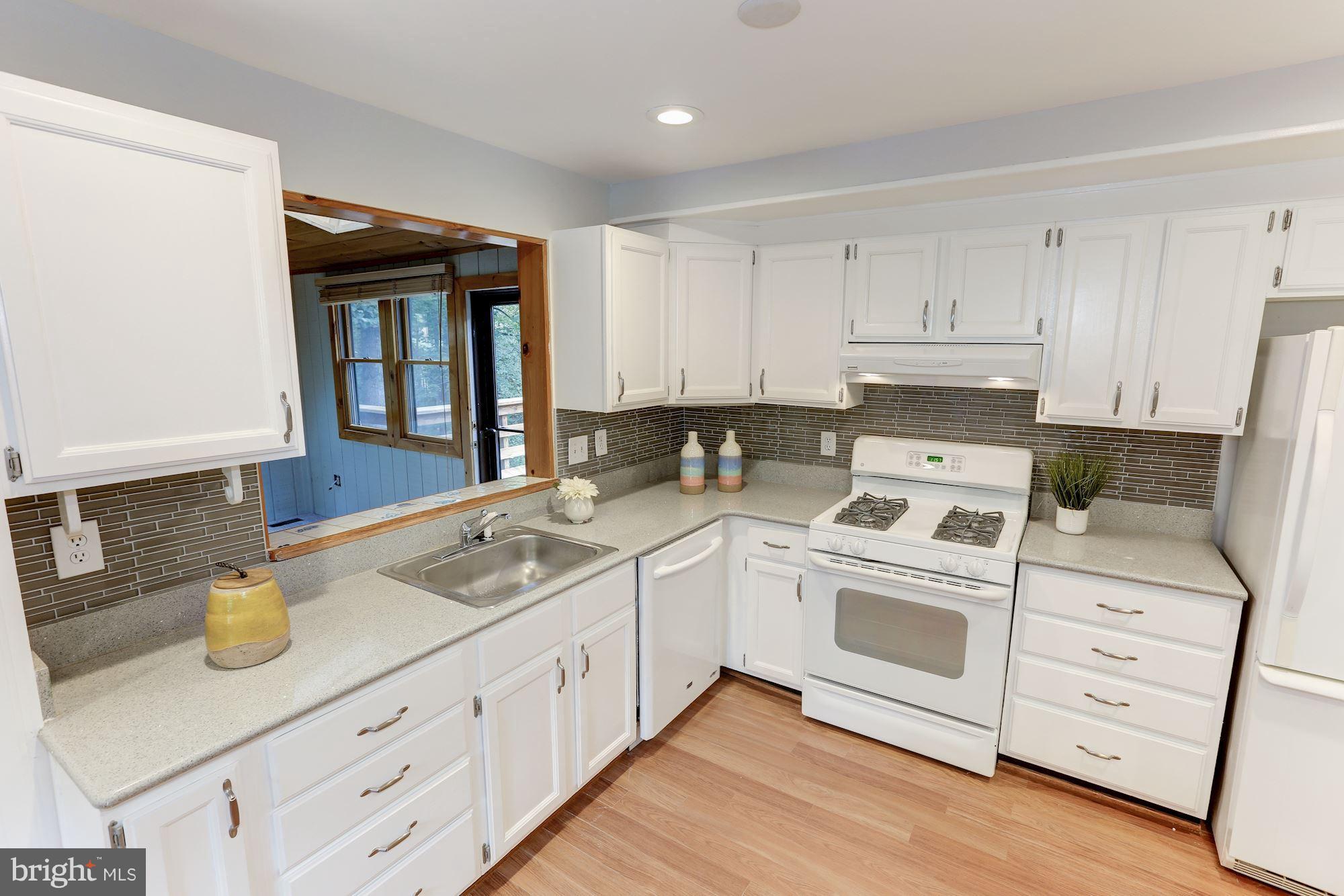11570 Embers Court Reston, VA 20191 - Photo 2 of 30 a kitchen with sink cabinets and window