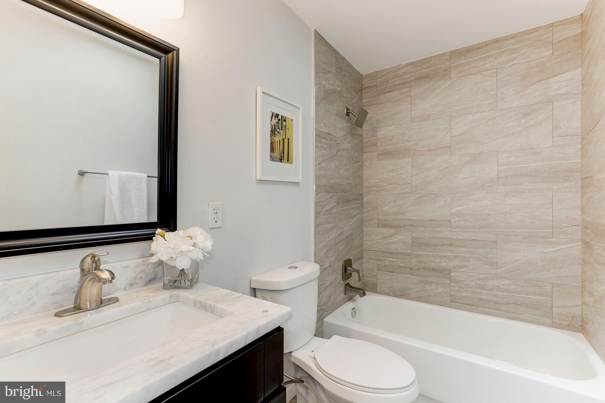 11570 Embers Court Reston, VA 20191 - Photo 14 of 30 a bathroom with a sink toilet and shower