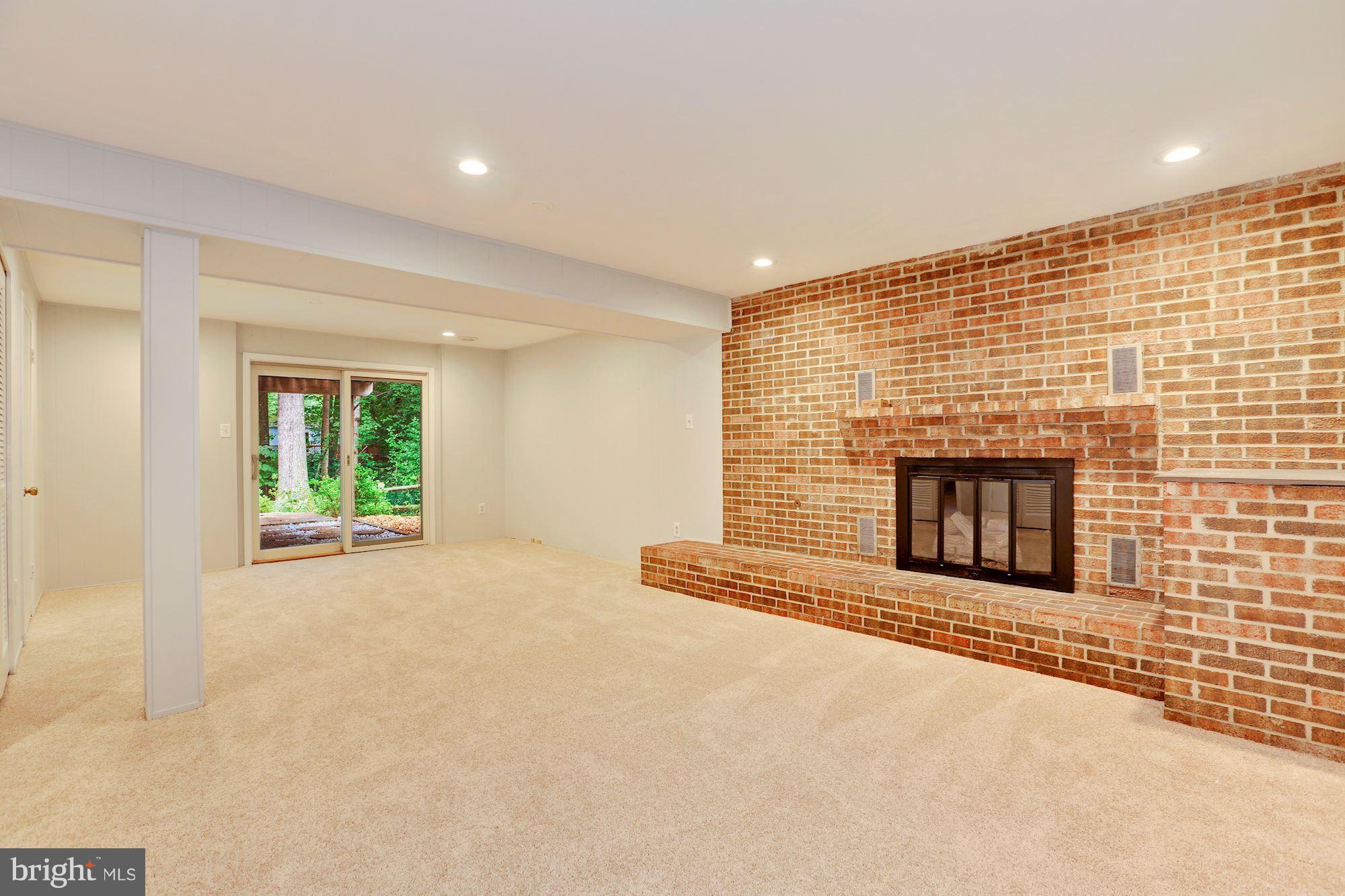 11570 Embers Court Reston, VA 20191 - Photo 16 of 30 a view of an empty room with a fireplace and a window