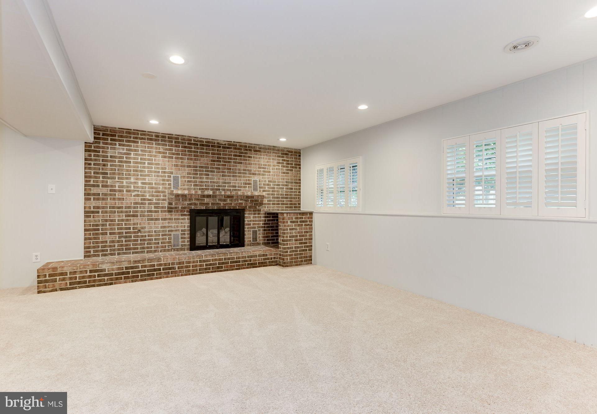 11570 Embers Court Reston, VA 20191 - Photo 19 of 30 an empty room with a fireplace and a window