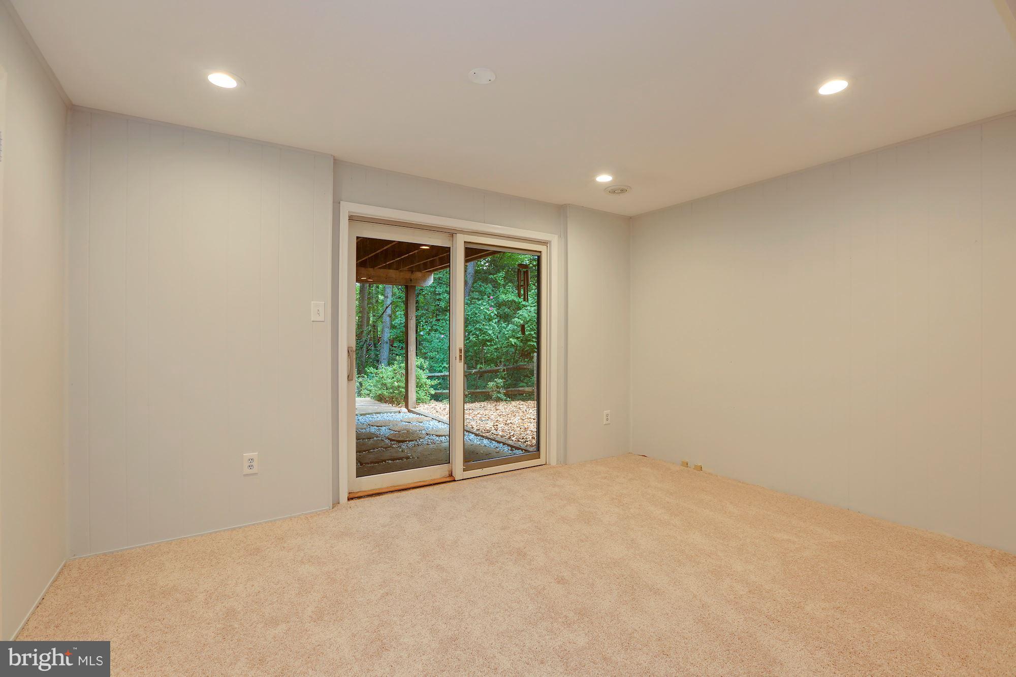 11570 Embers Court Reston, VA 20191 - Photo 20 of 30 an empty room with wooden floor and windows
