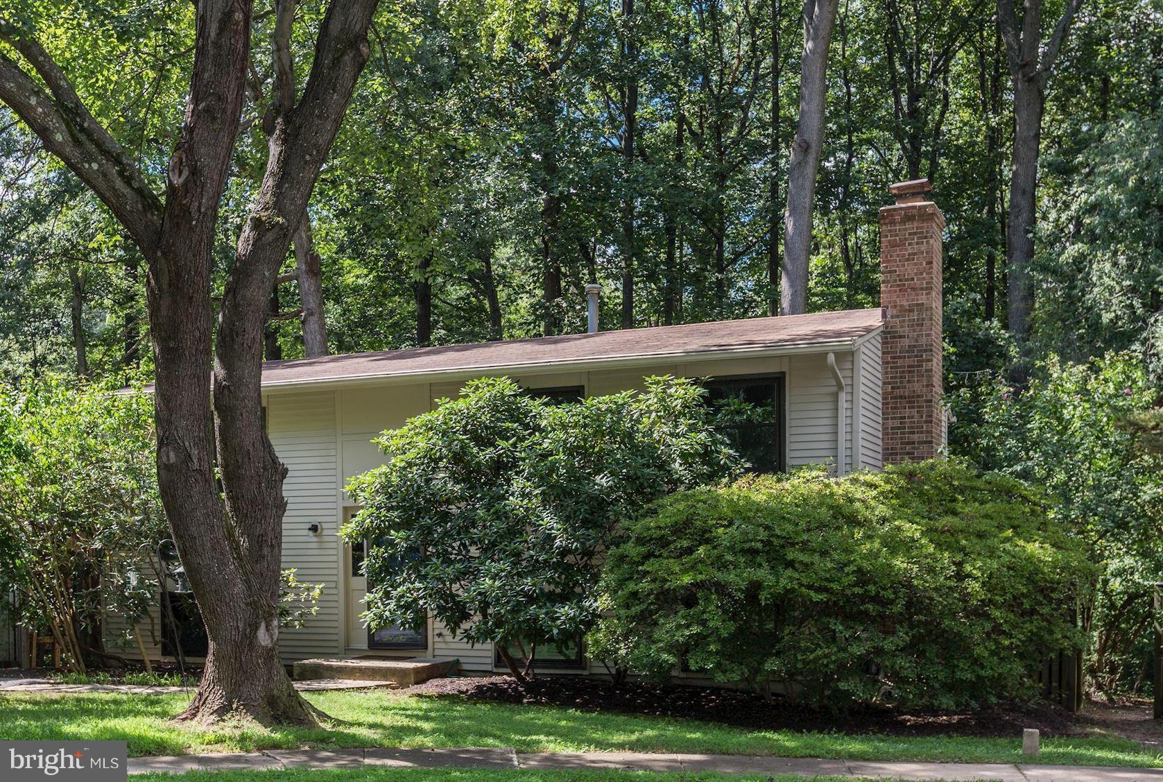 11570 Embers Court Reston, VA 20191 - Photo 27 of 30 a view of a house with a large tree and a yard