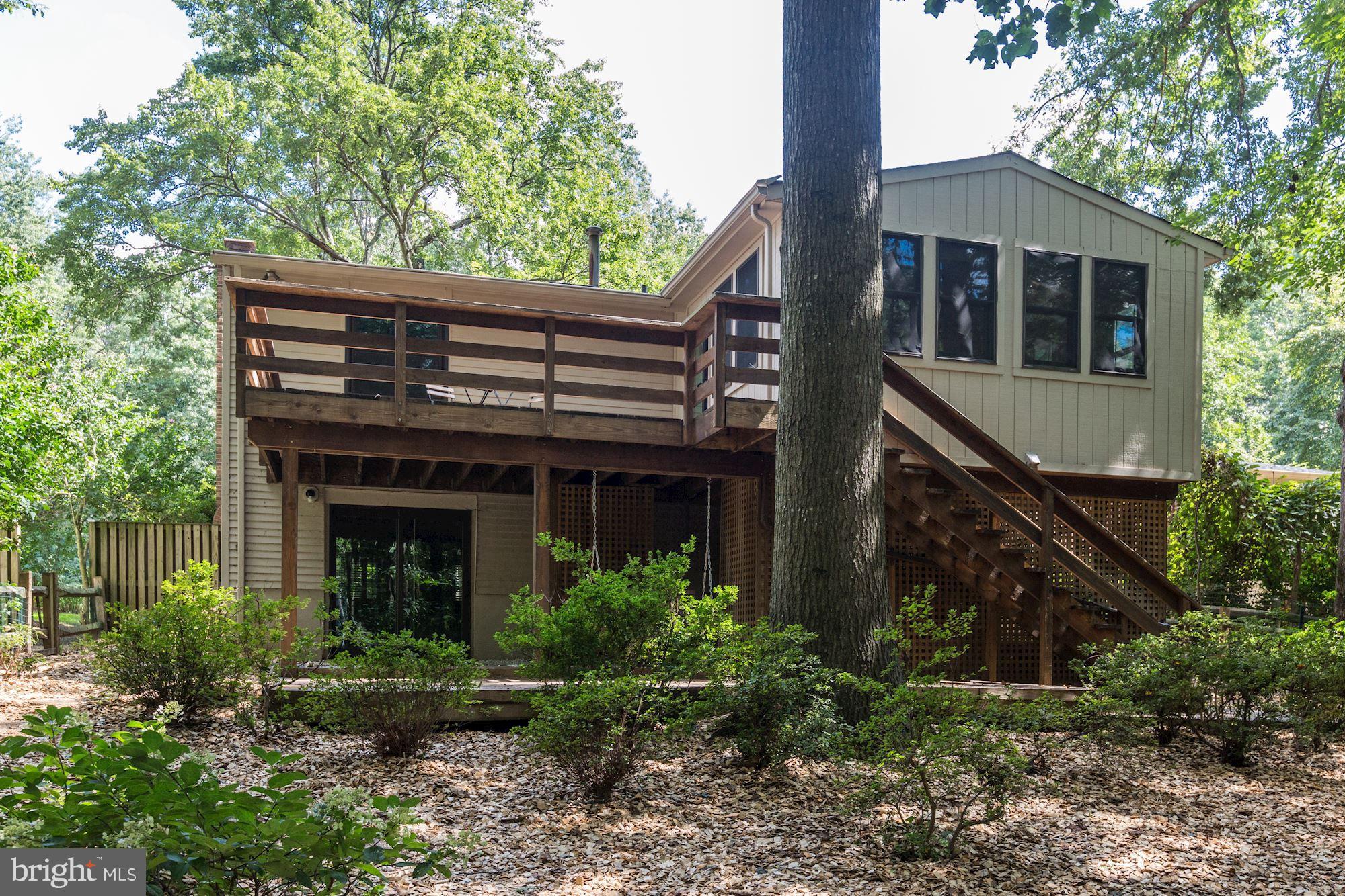 11570 Embers Court Reston, VA 20191 - Photo 29 of 30 a front view of house with yard and trees around