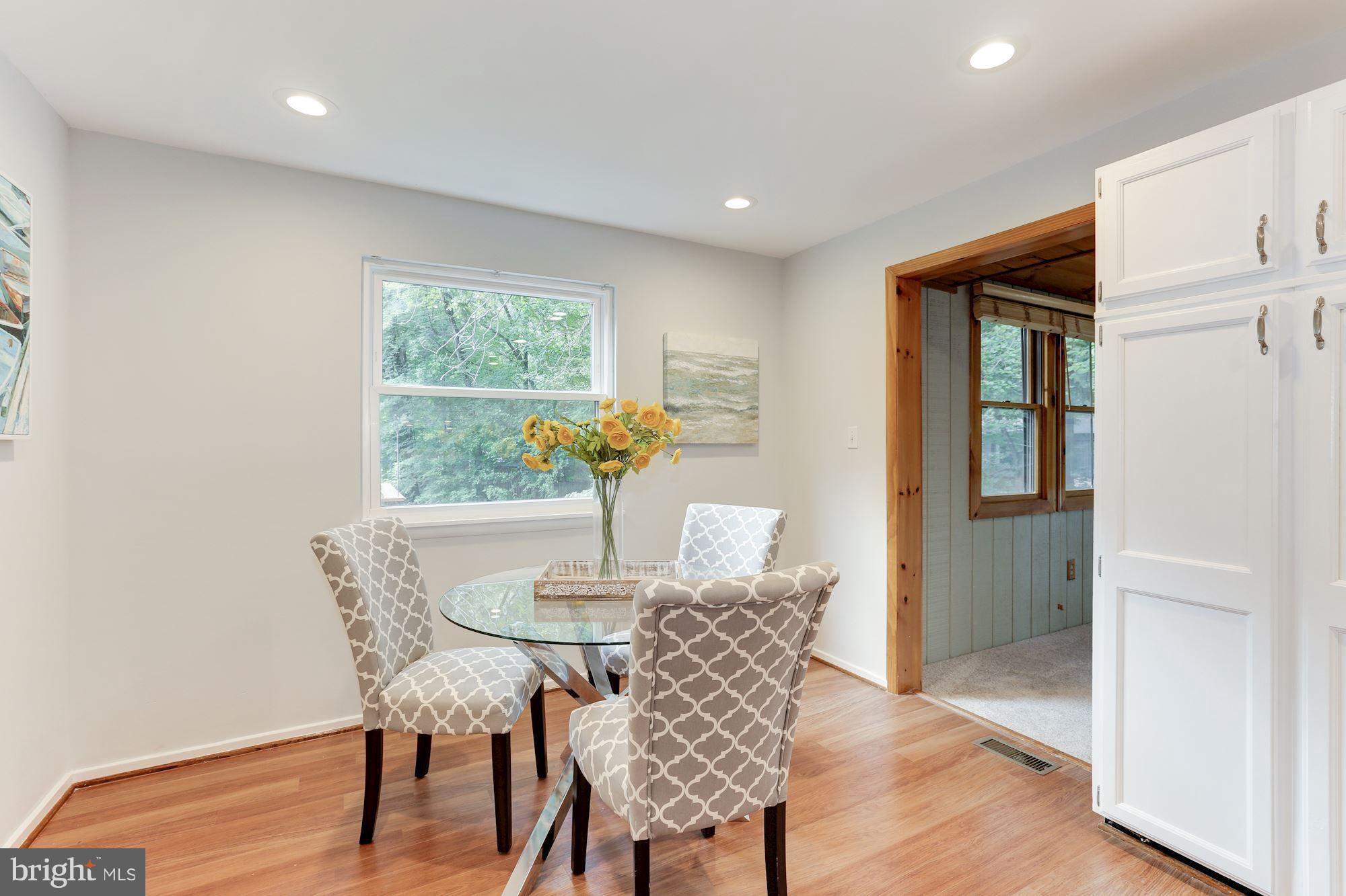 11570 Embers Court Reston, VA 20191 - Photo 7 of 30 a view of a dining room with furniture window and wooden floor