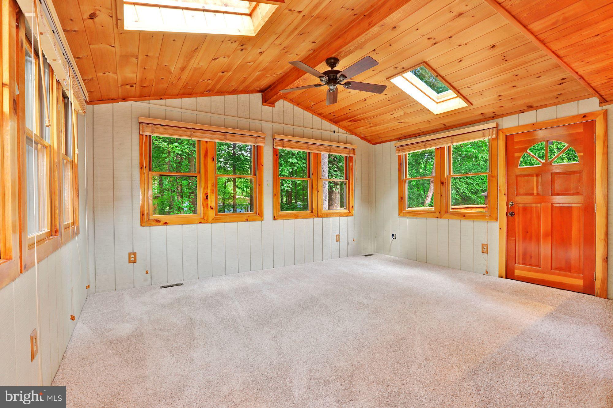 11570 Embers Court Reston, VA 20191 - Photo 8 of 30 a view of an empty room with a windows and a fireplace