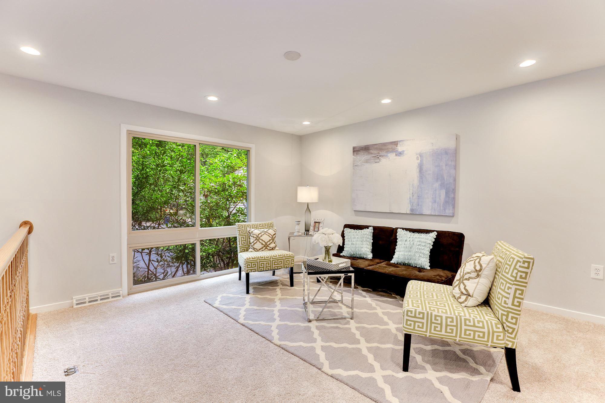 11570 Embers Court Reston, VA 20191 - Photo 10 of 30 a living room with furniture and a large window