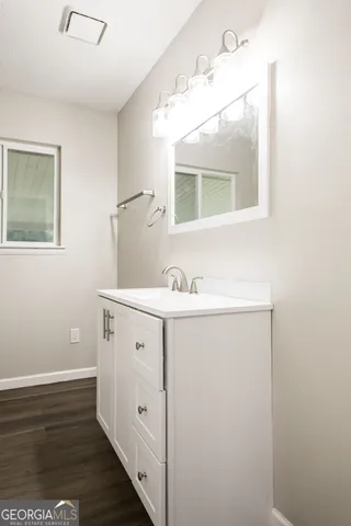 a bathroom with a bathtub and a sink