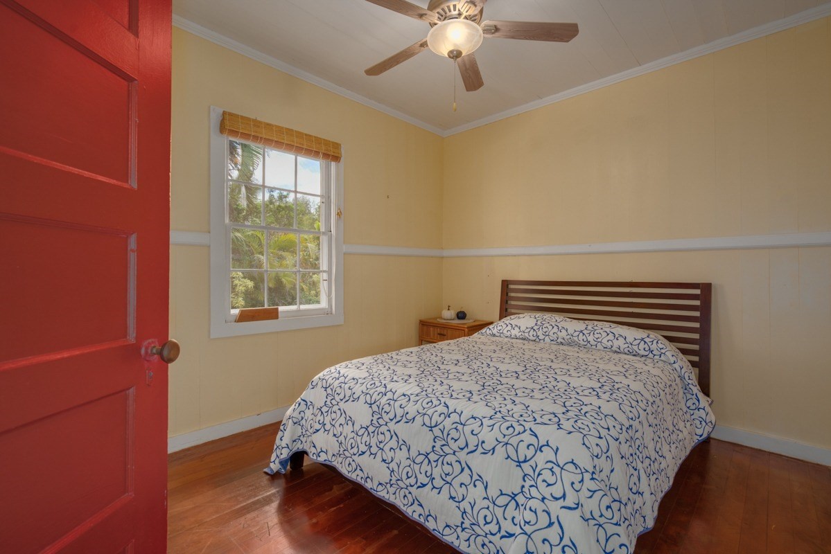 48-5263 Kukuihaele Road Honokaa, HI 96727 - Photo 11 of 30 a bedroom with a bed and a window
