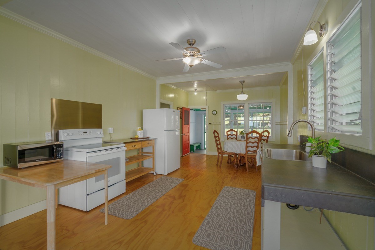 48-5263 Kukuihaele Road Honokaa, HI 96727 - Photo 5 of 30 a very nice looking dining room with a large window and stainless steel appliances