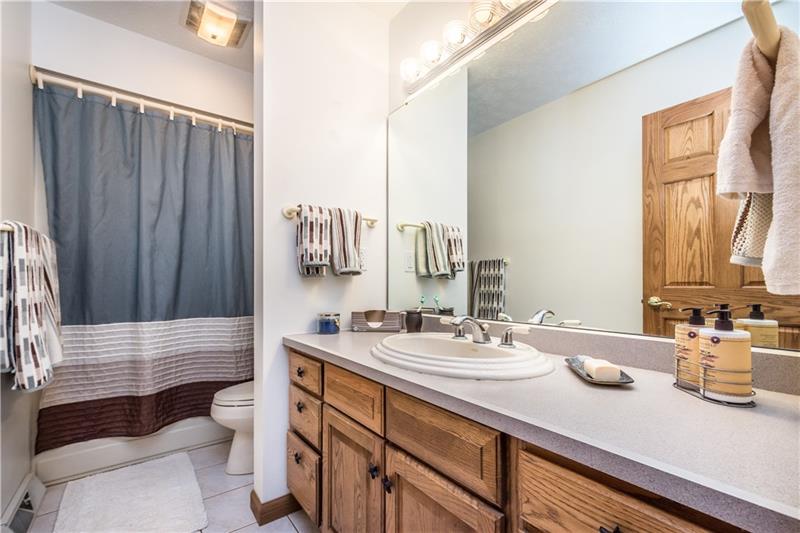 108 Castile Ridge Road Waynesburg, PA 15370 - Photo 20 of 25 The well-lit shared bathroom has a large vanity with plenty of storage.