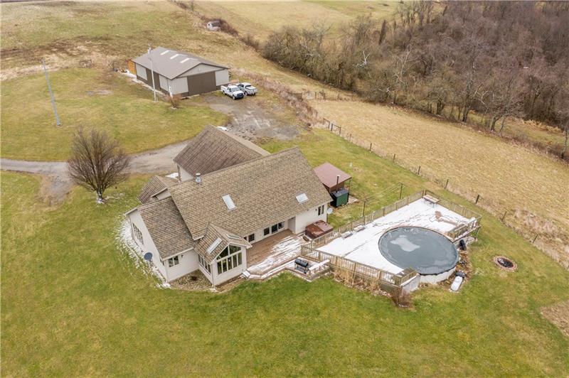 108 Castile Ridge Road Waynesburg, PA 15370 - Photo 3 of 25 Situated on more than 60 acres with two LARGE out buildings, fields and woods, this property gives you plenty of space to roam!