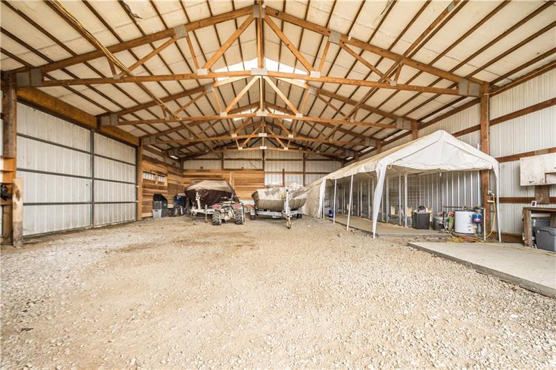 108 Castile Ridge Road Waynesburg, PA 15370 - Photo 7 of 25 The interior of this barn has a ton of potential...cars, boats, tractors, etc! Currently there are eight 4x4 pens with heated floors and each exits to a 4x8 outdoor run. Cedar planks wrap around one corner.