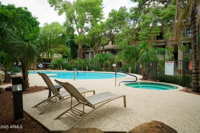 a view of a backyard with sitting area