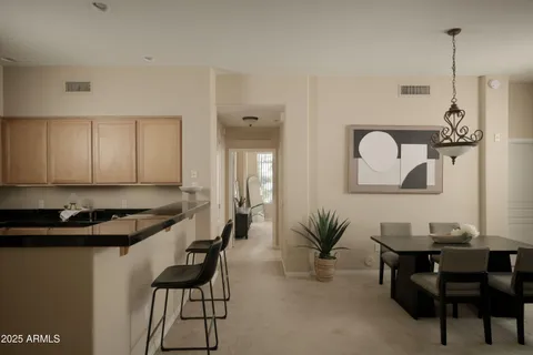 a kitchen with a table and chairs in it