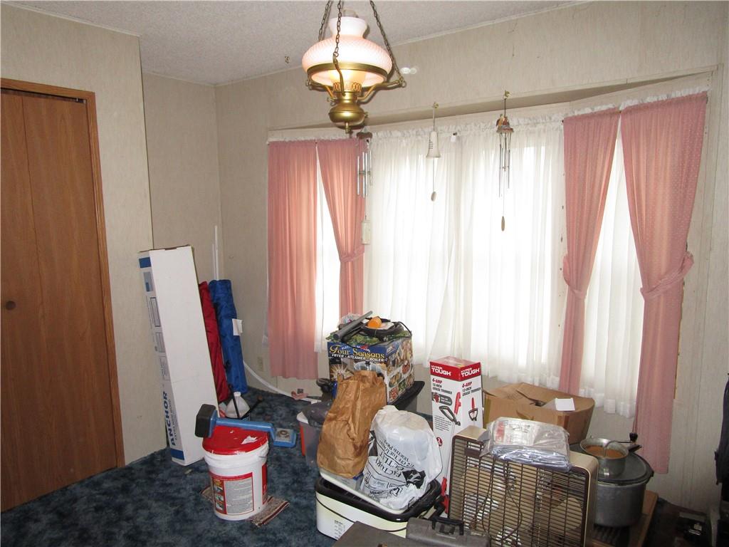 69 South Summit Road Greenville, PA 16125 - Photo 12 of 15 a very nice looking room with a chair and a chandelier