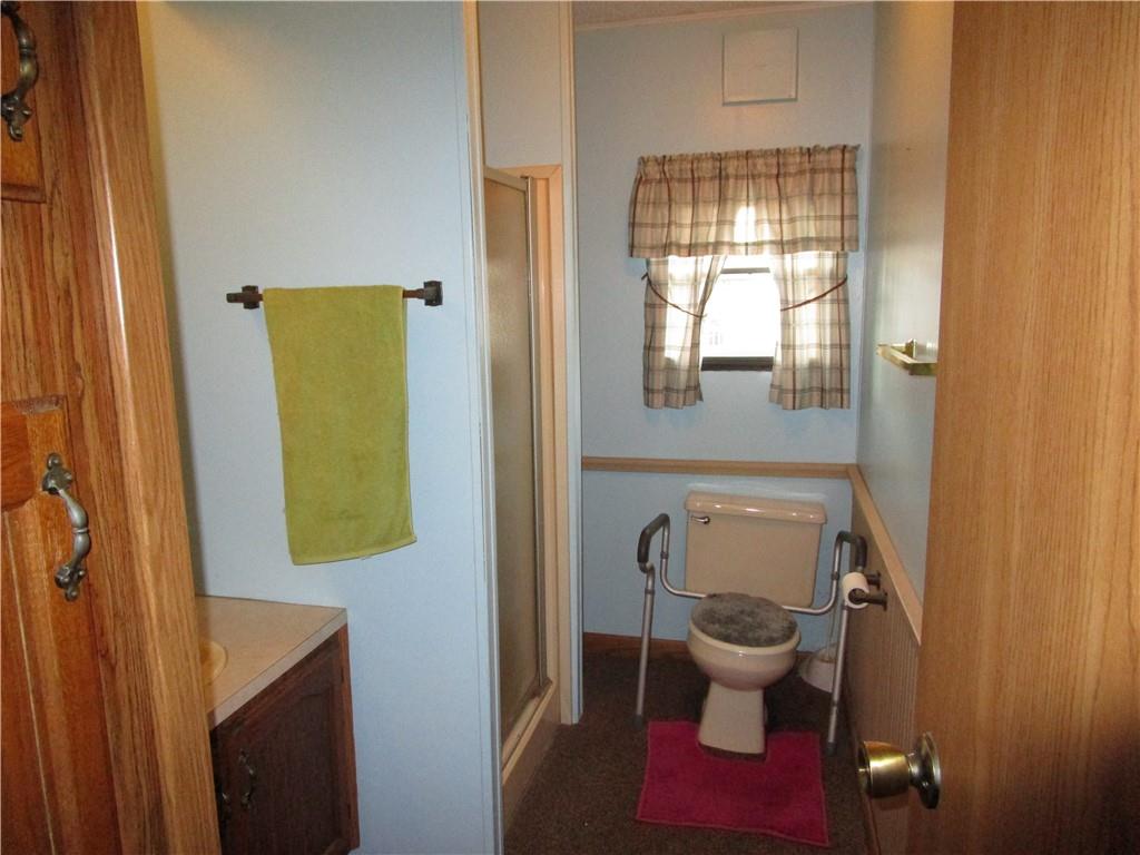 69 South Summit Road Greenville, PA 16125 - Photo 13 of 15 a bathroom with a toilet and a shower curtain