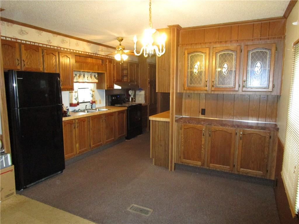 69 South Summit Road Greenville, PA 16125 - Photo 5 of 15 a kitchen with refrigerator and window